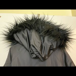 Members Only women’s jacket Black with black fur interior.